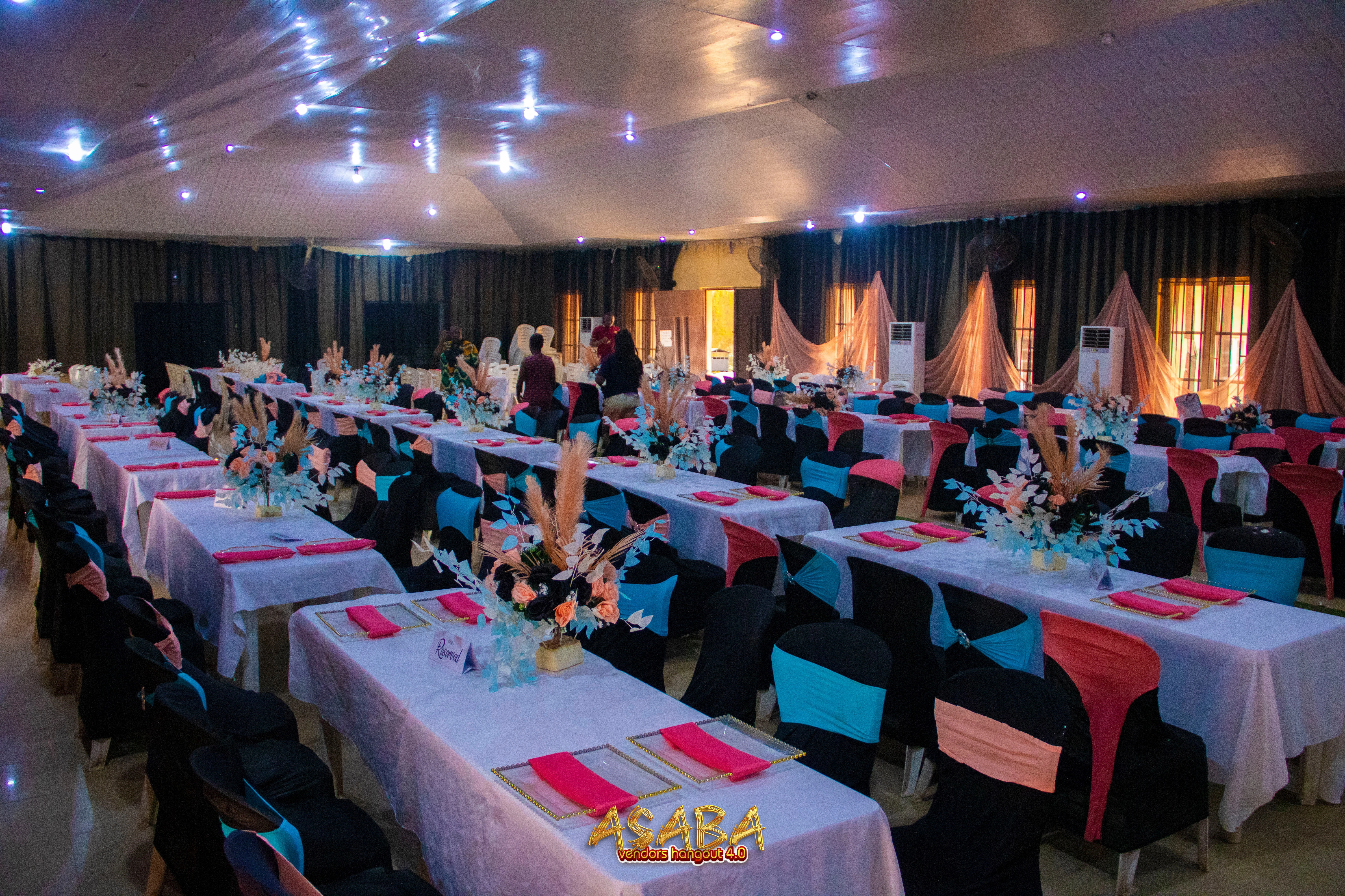 Asaba Business Community vendor exhibition showing stalls and visitors